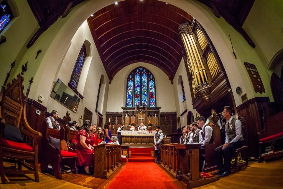 Interior of a church during a wedding ceremony.