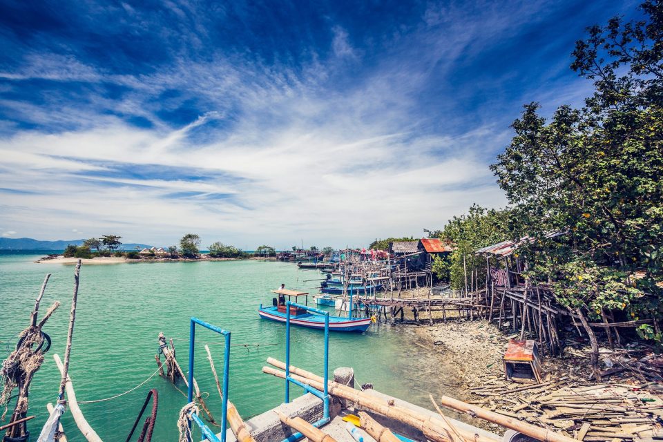 A tropical coastal landscape with turquoise water.