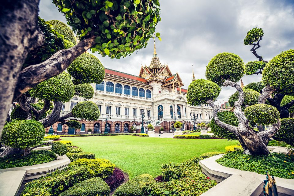This is a front view of an ornate palatial building with tiered roofs.
