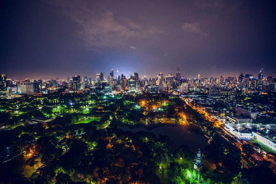 This is a night-time panoramic view of an illuminated city.